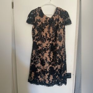 Gorgeous black sequin and lace over tan/nude dress